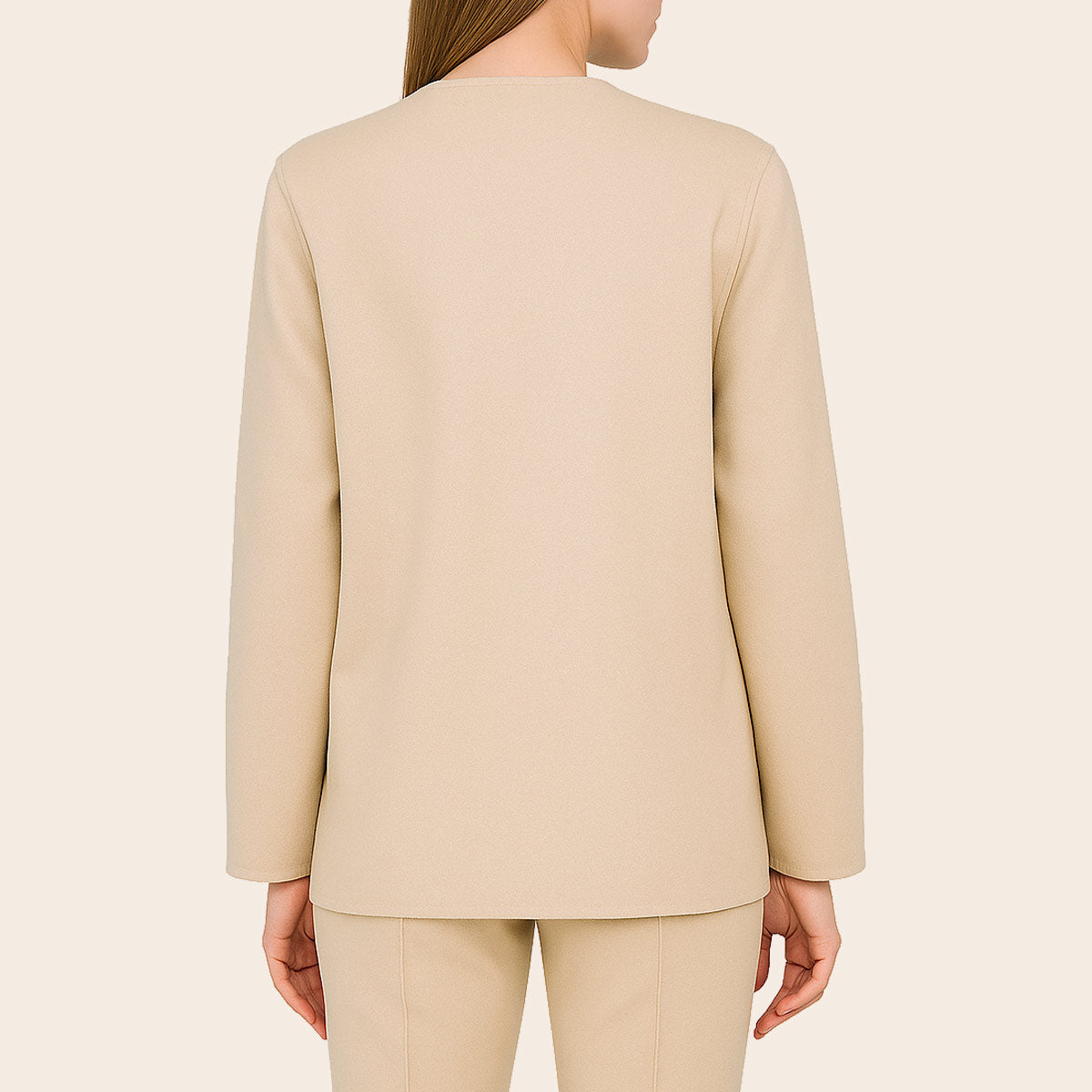Beige suit jacket worn by a person on a beige background